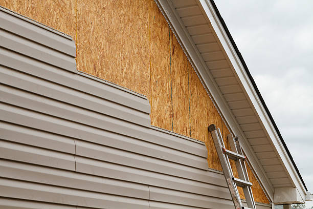 Professional Siding technician working in West Babylon, NY